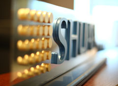 SHUAA Logo On Desk